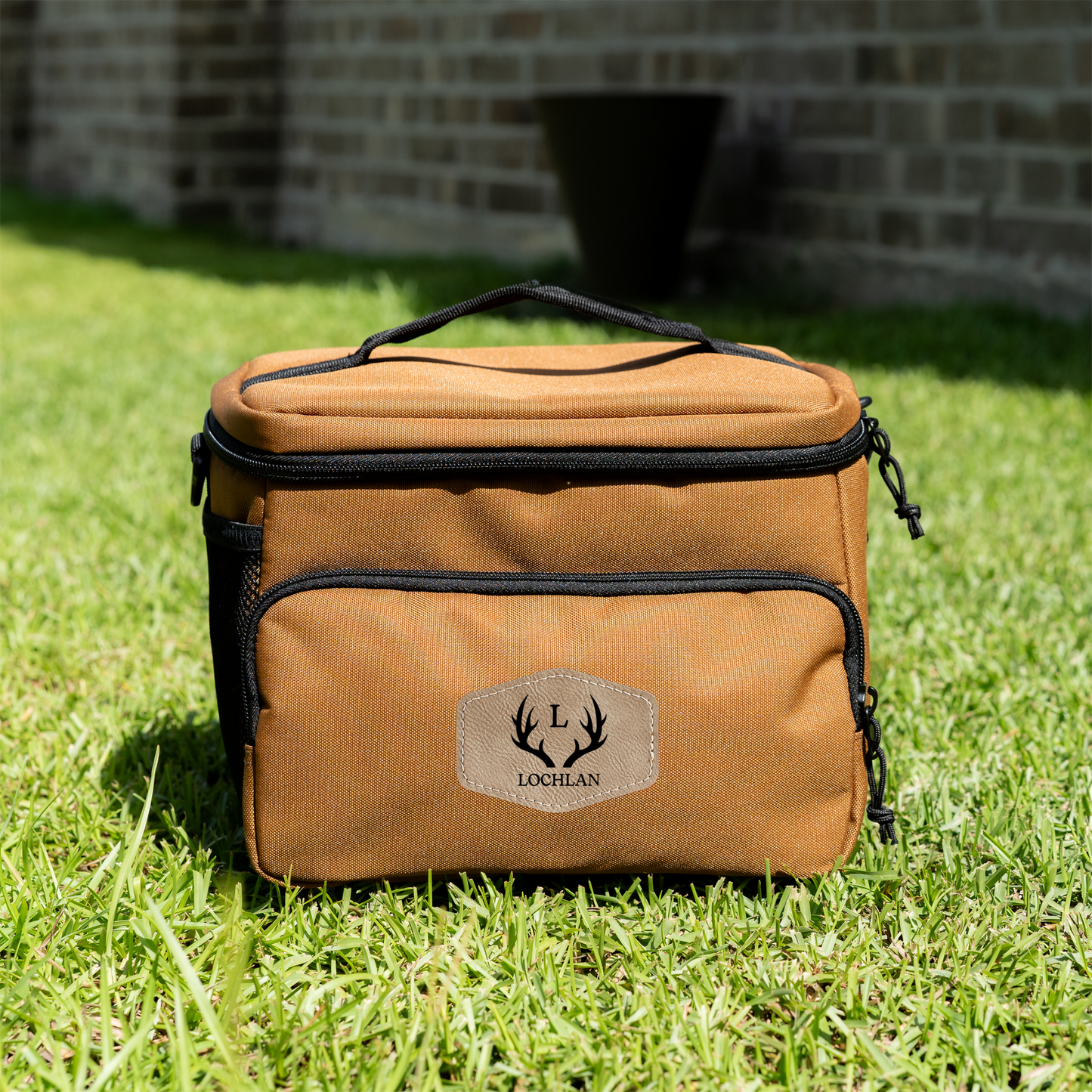 Engraved leather patch detail on custom insulated travel cooler for groomsmen