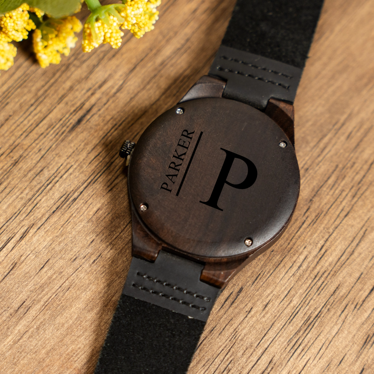 Engraved dark brown wood watch close-up - anniversary gift