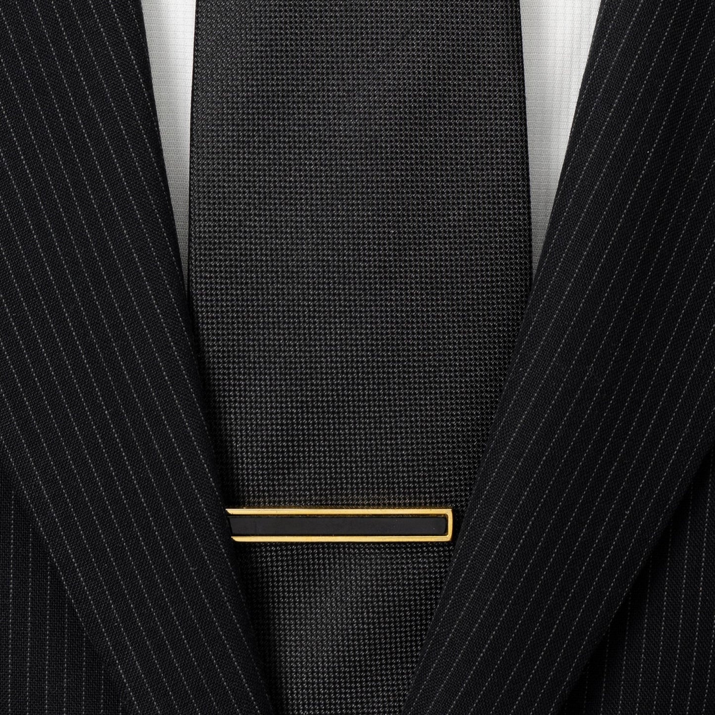 Gold and onyx tie clip close-up, custom wedding gift for the groom