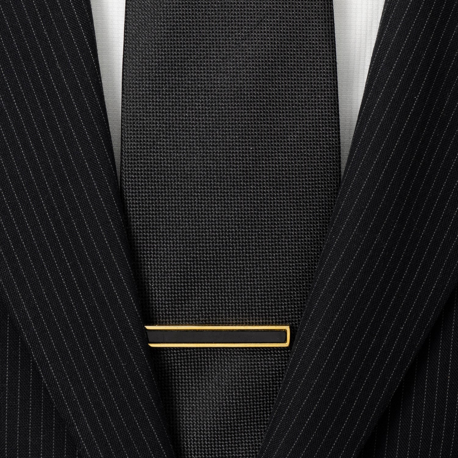 Gold and onyx tie clip close-up, custom wedding gift for the groom