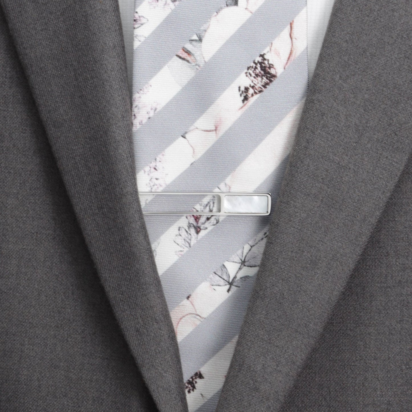 Mother of pearl die cut tie clip close-up, custom wedding gift