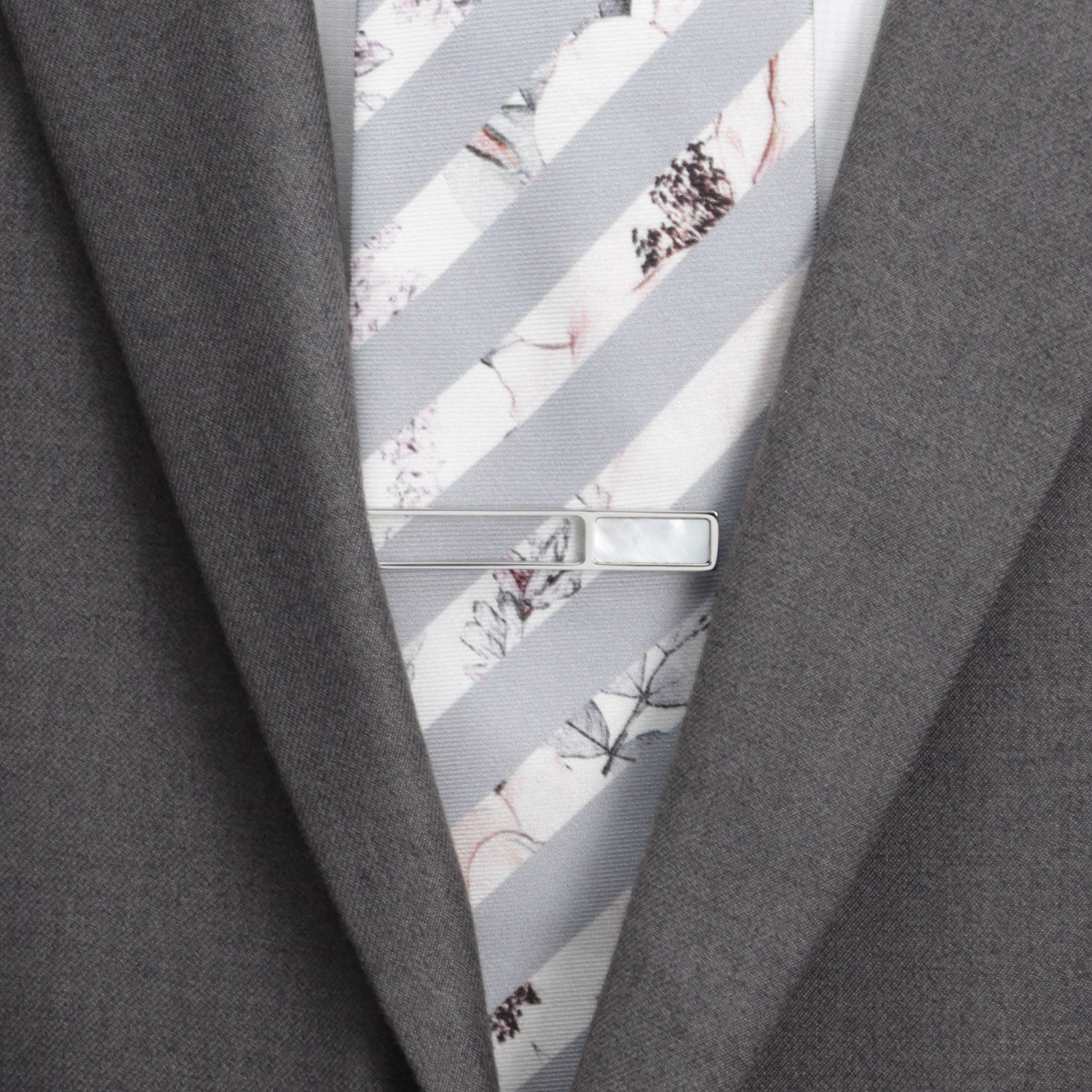 Mother of pearl die cut tie clip close-up, custom wedding gift