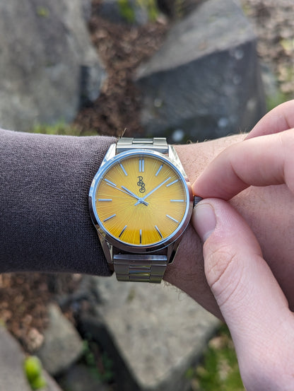 Yellow Sunburst Watch on steel being set, Father's Day gift