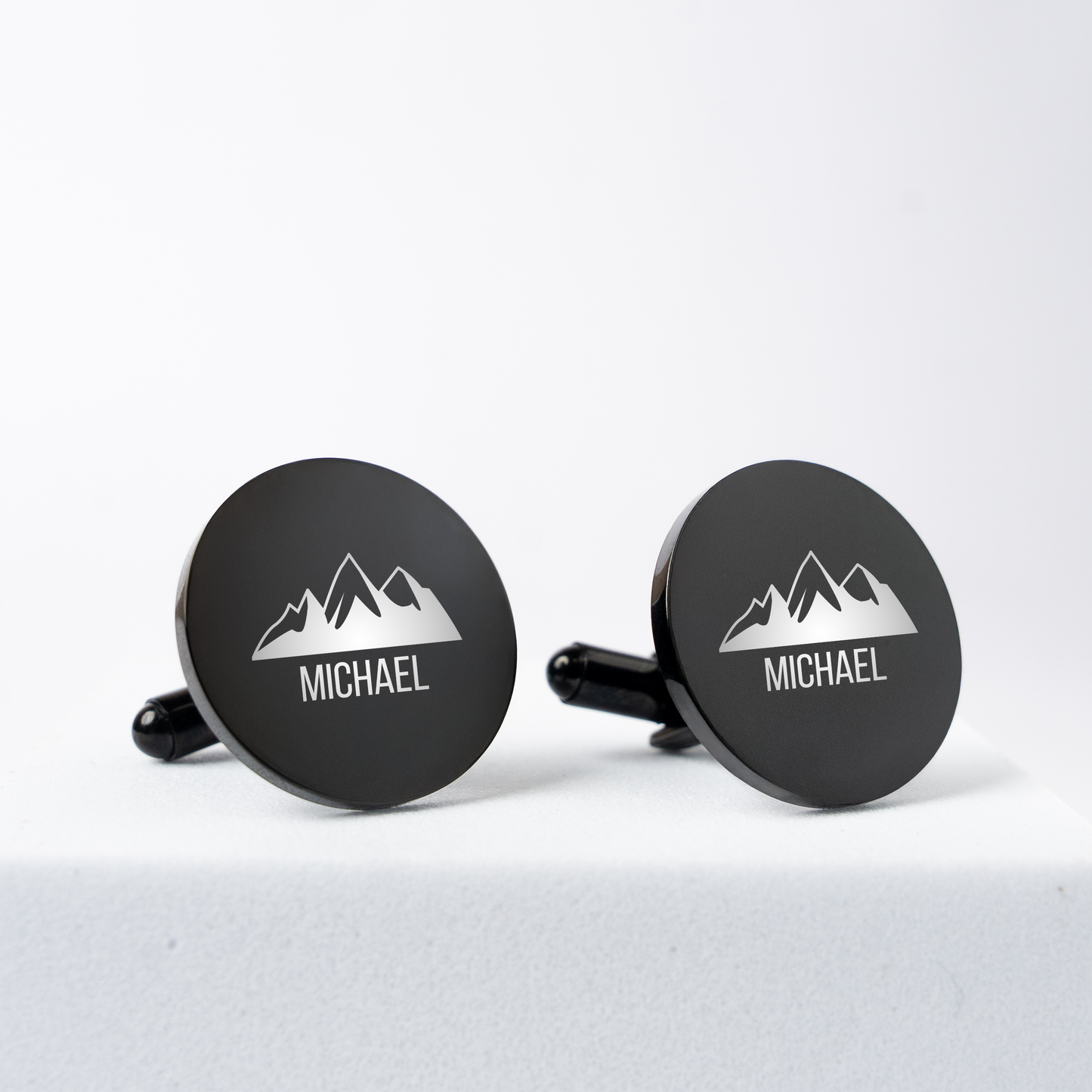 Engraved black cufflinks shown with monogram, best man gift