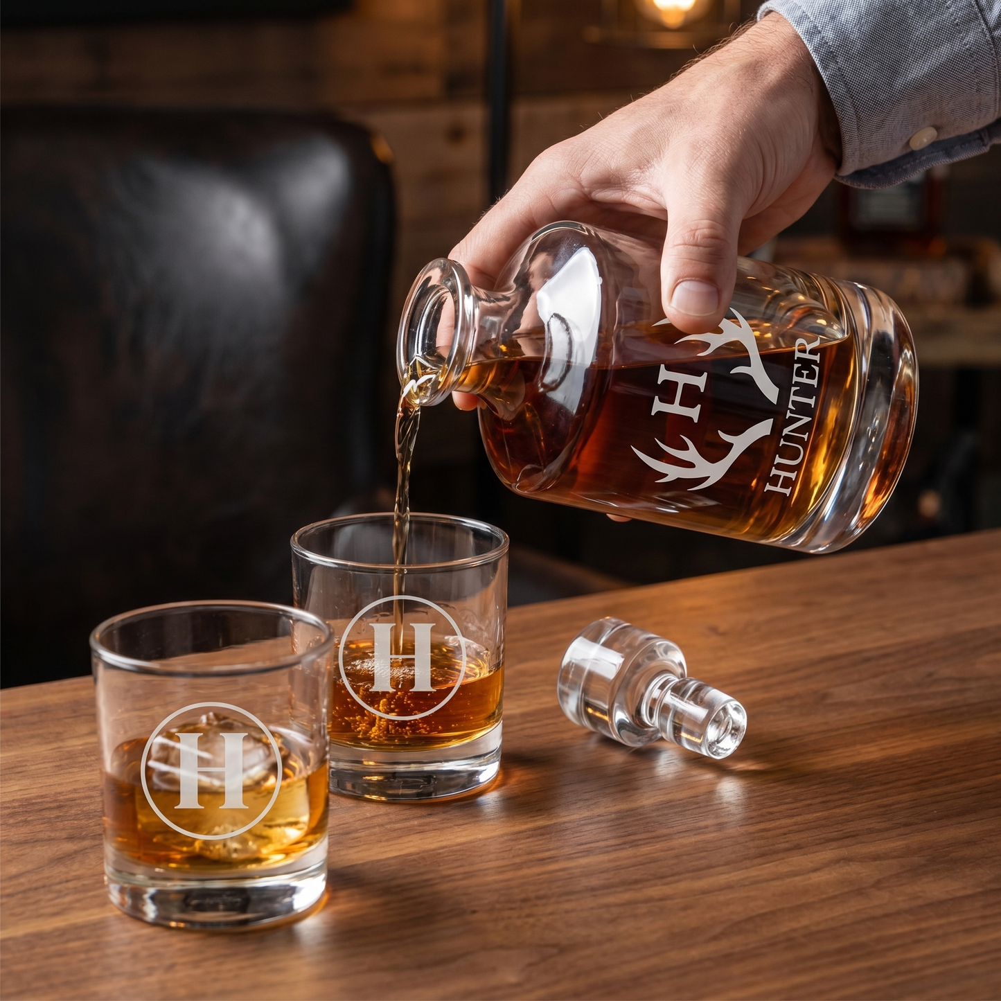 Engraved Barrel Decanter Set lifestyle - pouring amber whiskey from personalized decanter into matching engraved lowball glass