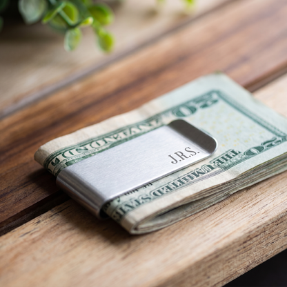 Silver engraved money clip holding folded cash - everyday carry groomsman gift