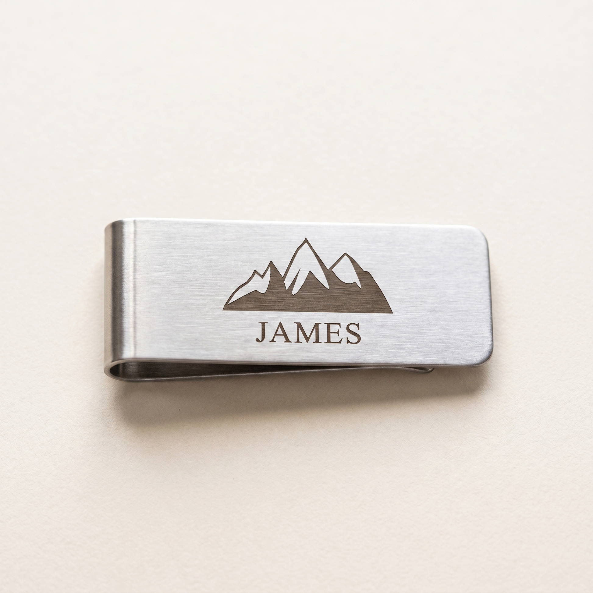 Engraved silver metal money clip with mountain design and the name James - best man gift