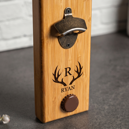 Close-up of engraved bamboo bottle opener showing the magnetic cap catch detail