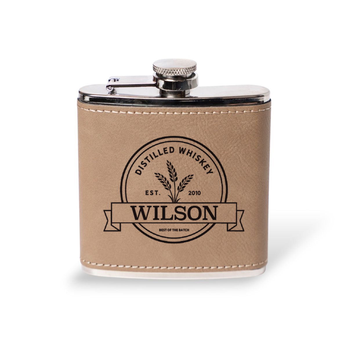 Light brown leather flask engraved with the Wilson distilled whiskey label, personalized groomsmen gift