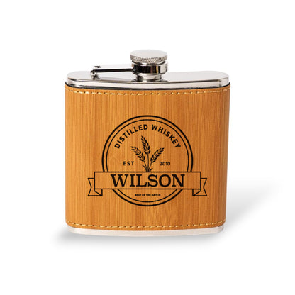 Pink leather flask engraved with the Wilson distilled whiskey label, wedding party gift