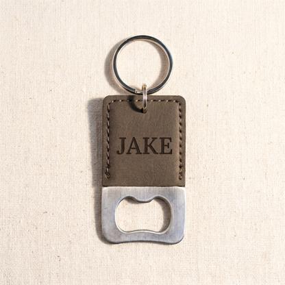 Engraved keychain bottle opener in dark brown vegan leather with JAKE engraving — Reserve Collection