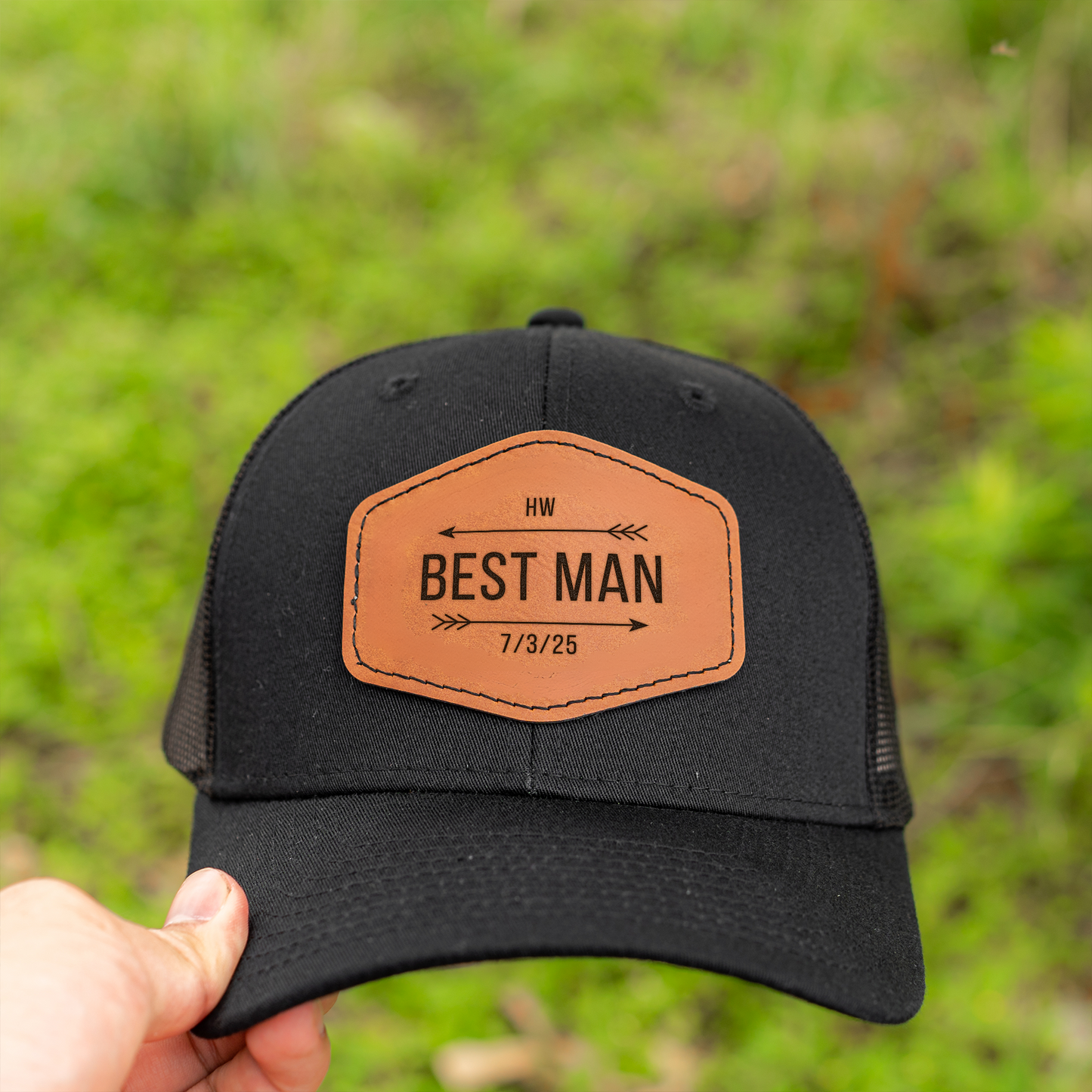 Black trucker hat with engraved leather patch best man gift