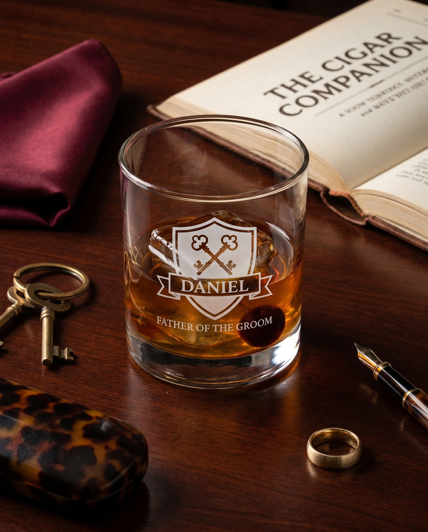 Personalized lowball whiskey glass with heraldic crossed-keys crest engraving — gentleman's library styling