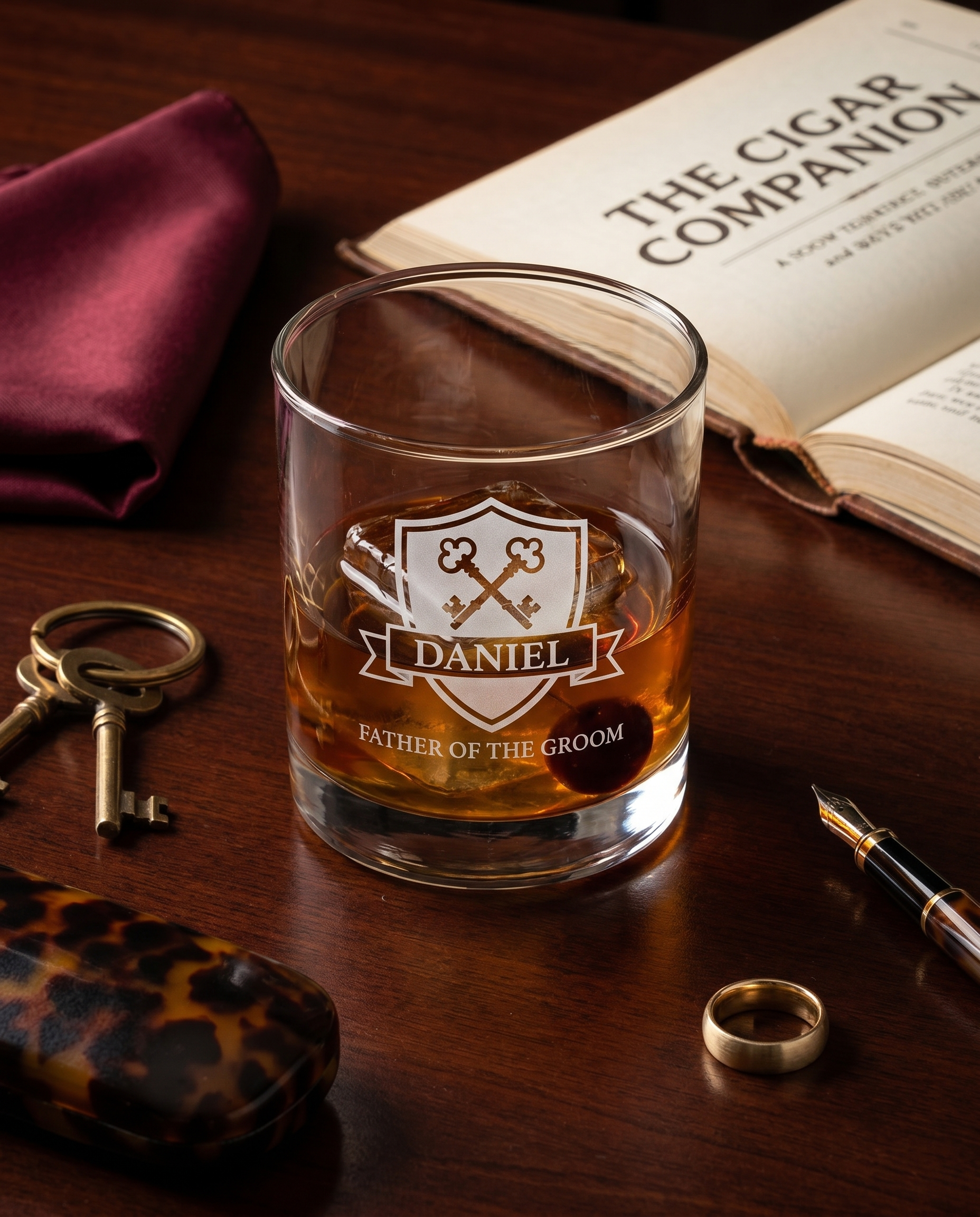Personalized lowball whiskey glass with heraldic crossed-keys crest engraving — gentleman's library styling