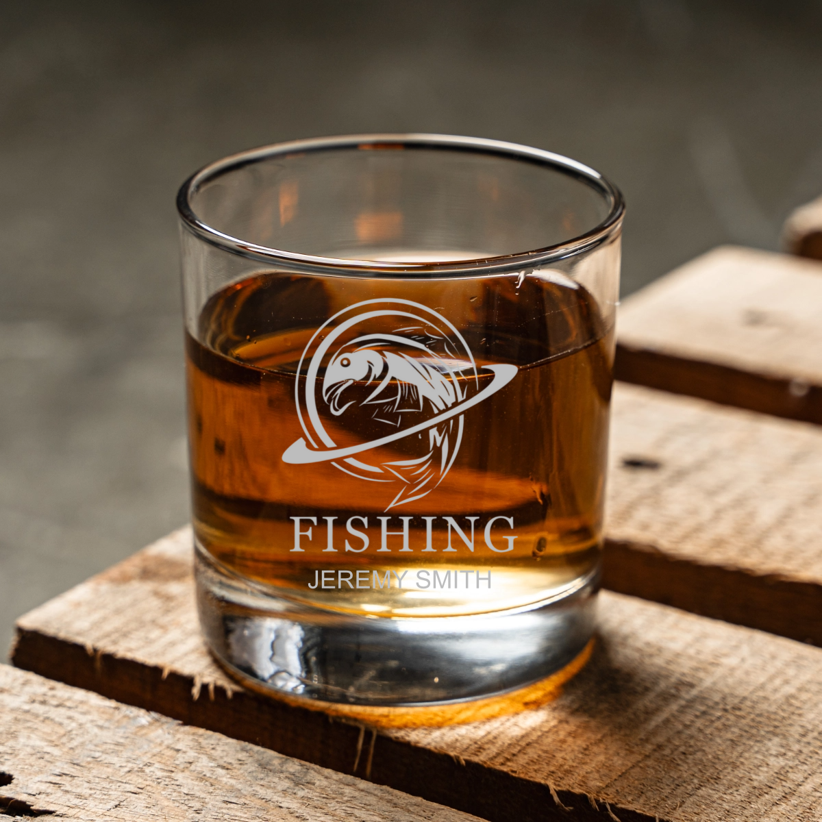 Engraved fishing whiskey glass close-up, Father's Day gift