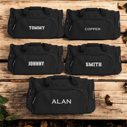 Black duffle bags arranged in set of 5 - bulk groomsmen gift
