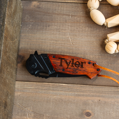 Custom engraved red handle knife in wooden presentation box view 2