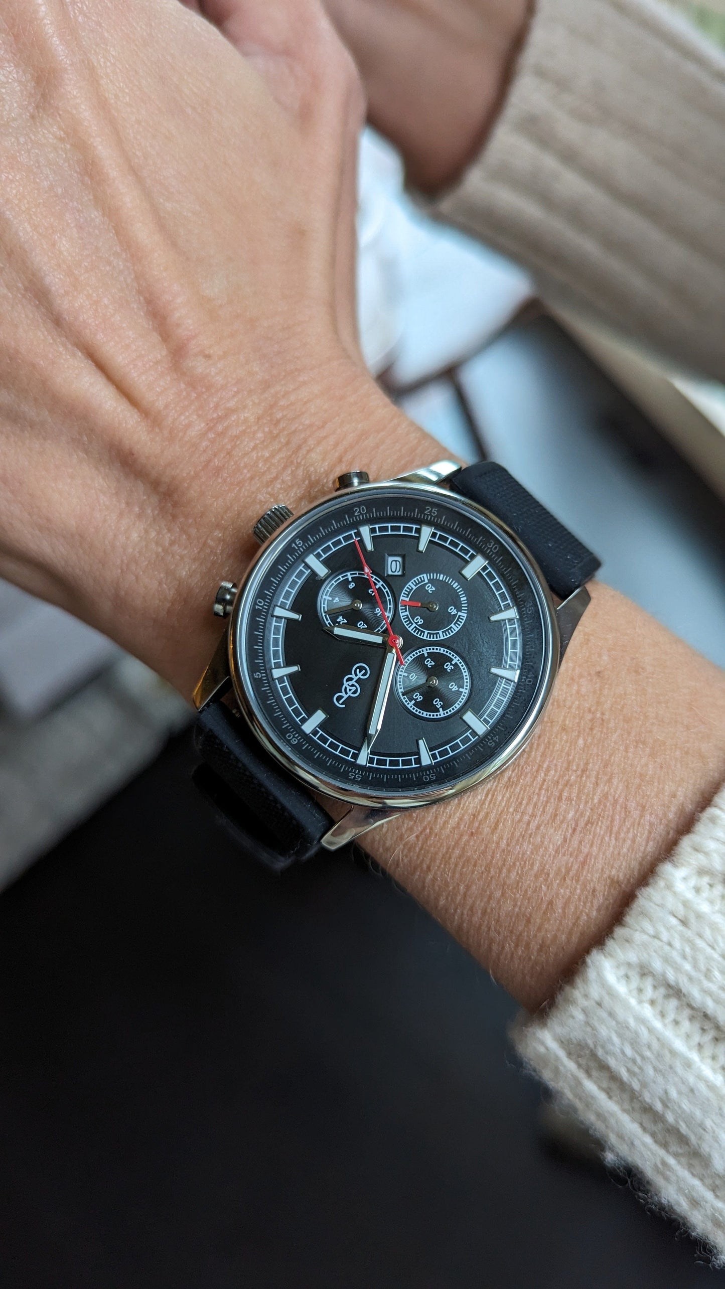 Black sport chronograph side profile case detail view