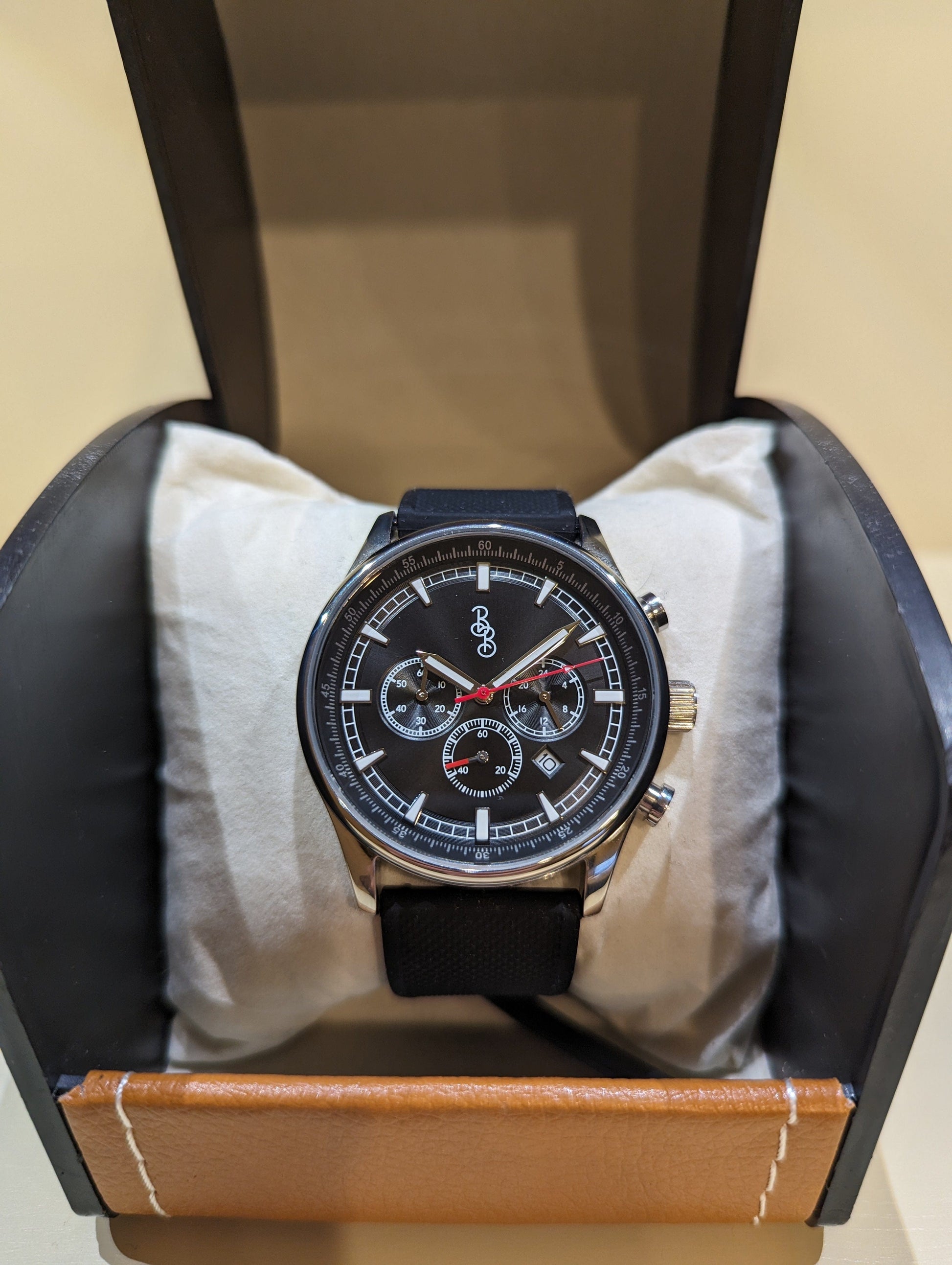 Black sport chronograph dial detail view, men's gift watch