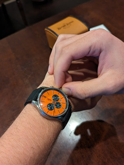 Orange and Black Chronograph wrist lifestyle shot, anniversary gift
