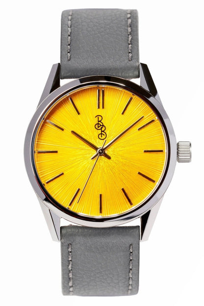 Yellow sunburst dial watch face close-up, Father's Day gift