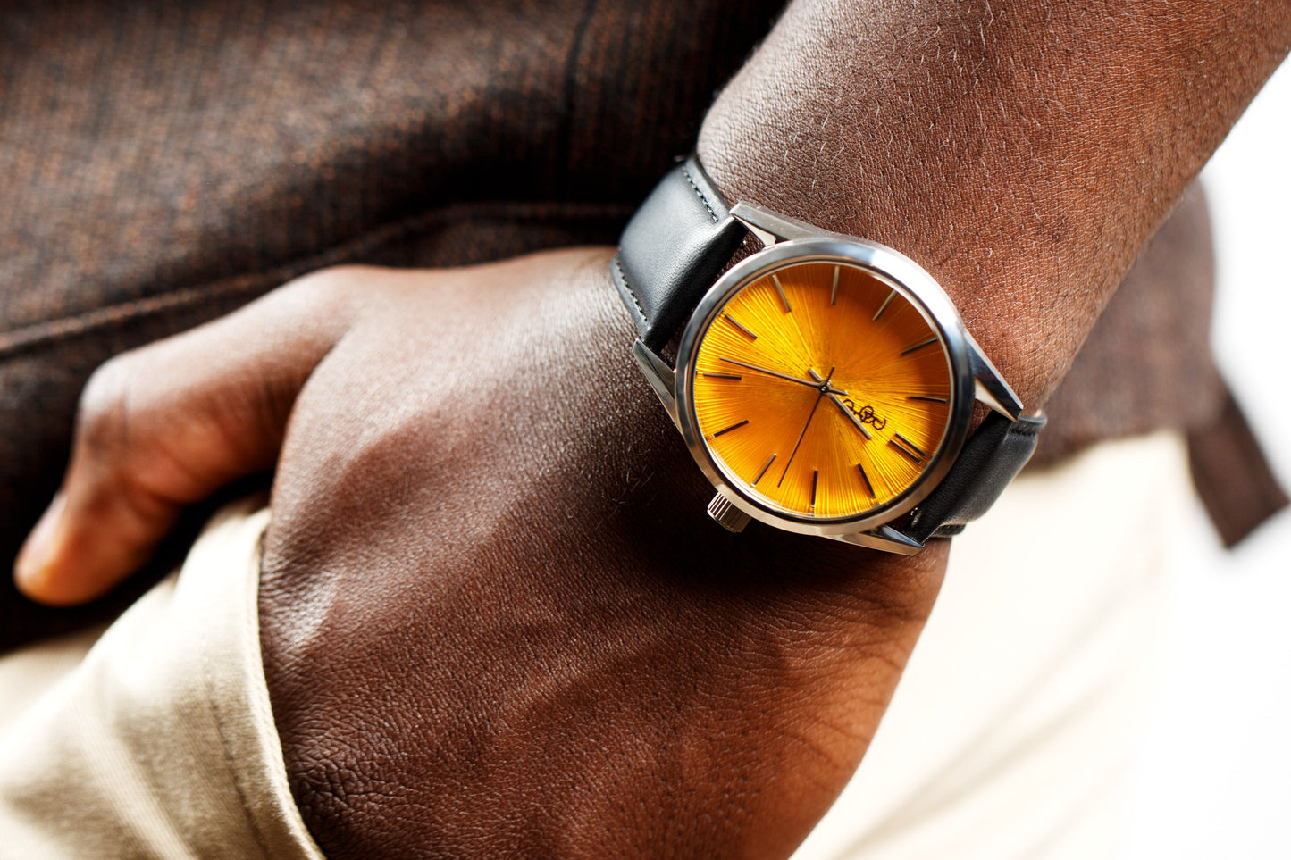 Yellow sunburst watch lifestyle shot, gift for him